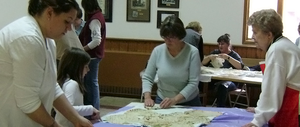 Our Savior's church members making lefse